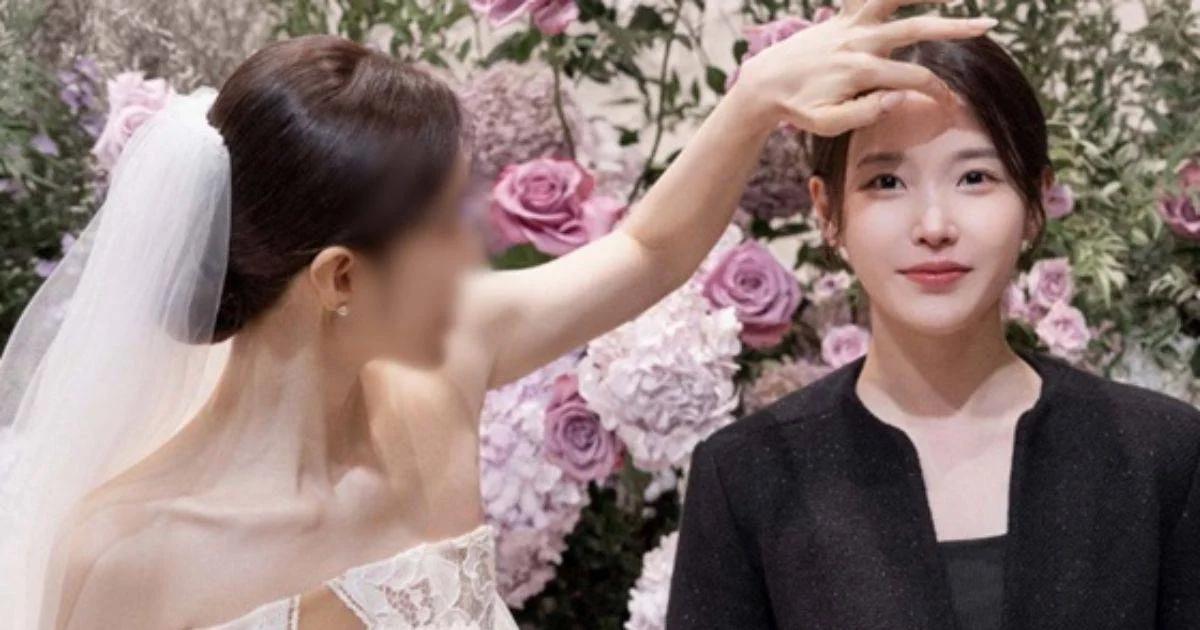 IU’s hairstylist fixes her hair at her own wedding in a moment that surprises fans