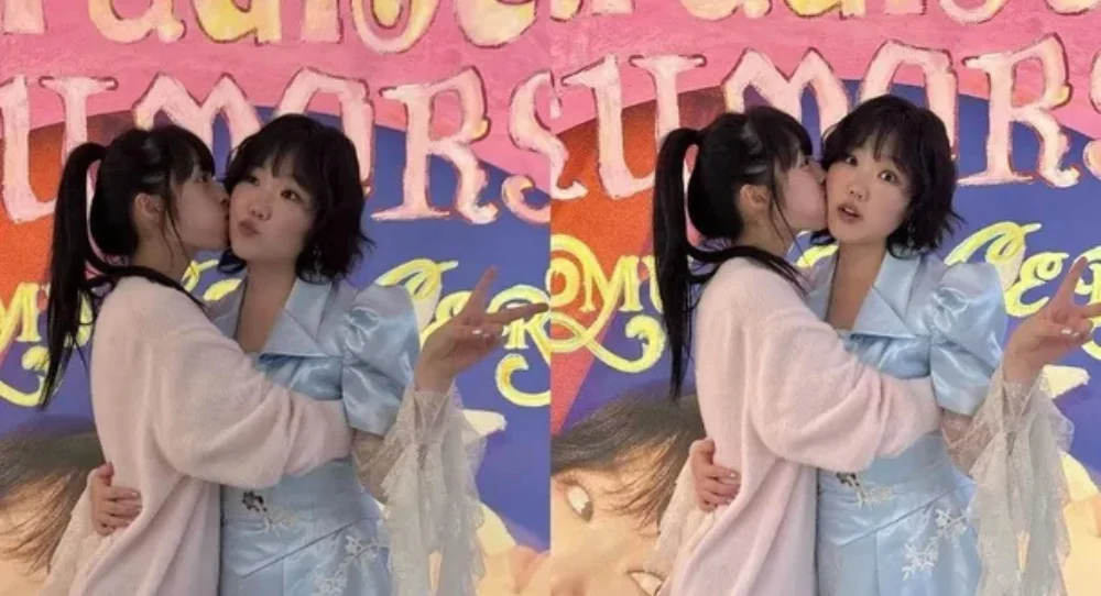 AKMU’s Lee Suhyun gets a surprise cheek kiss from longtime friend Kim Bo Ra